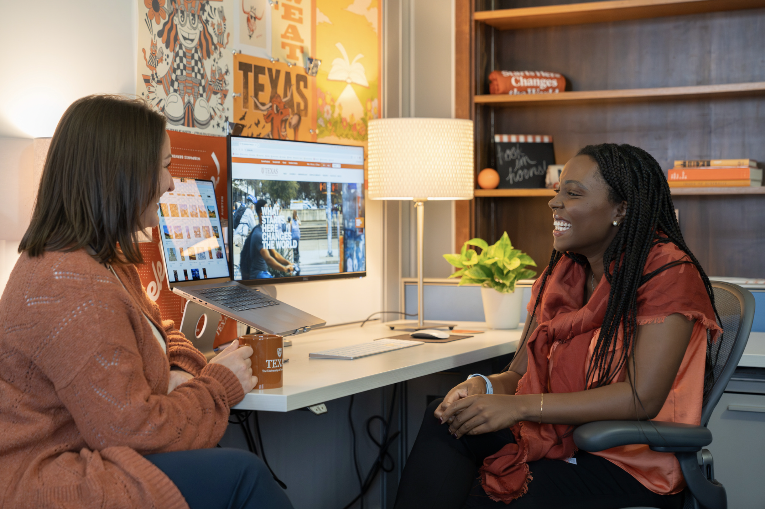 Students talking at a desk